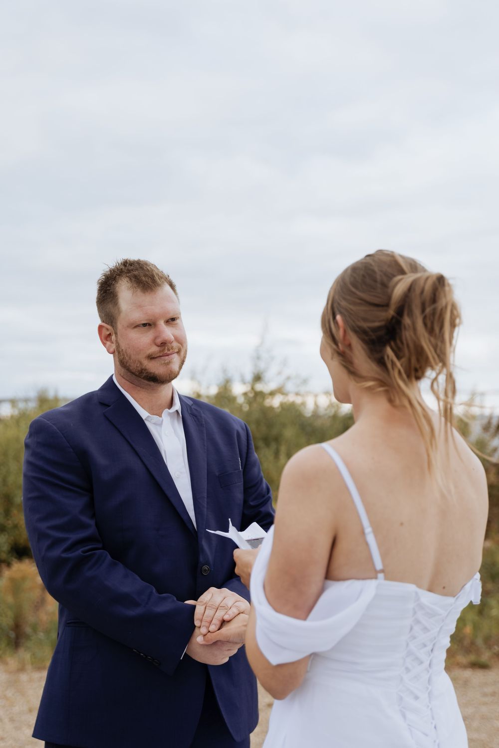 Bride and groom read vows during coastal wedding ceremony in New Brunswick, fall October wedding photography Moncton elopement portraits