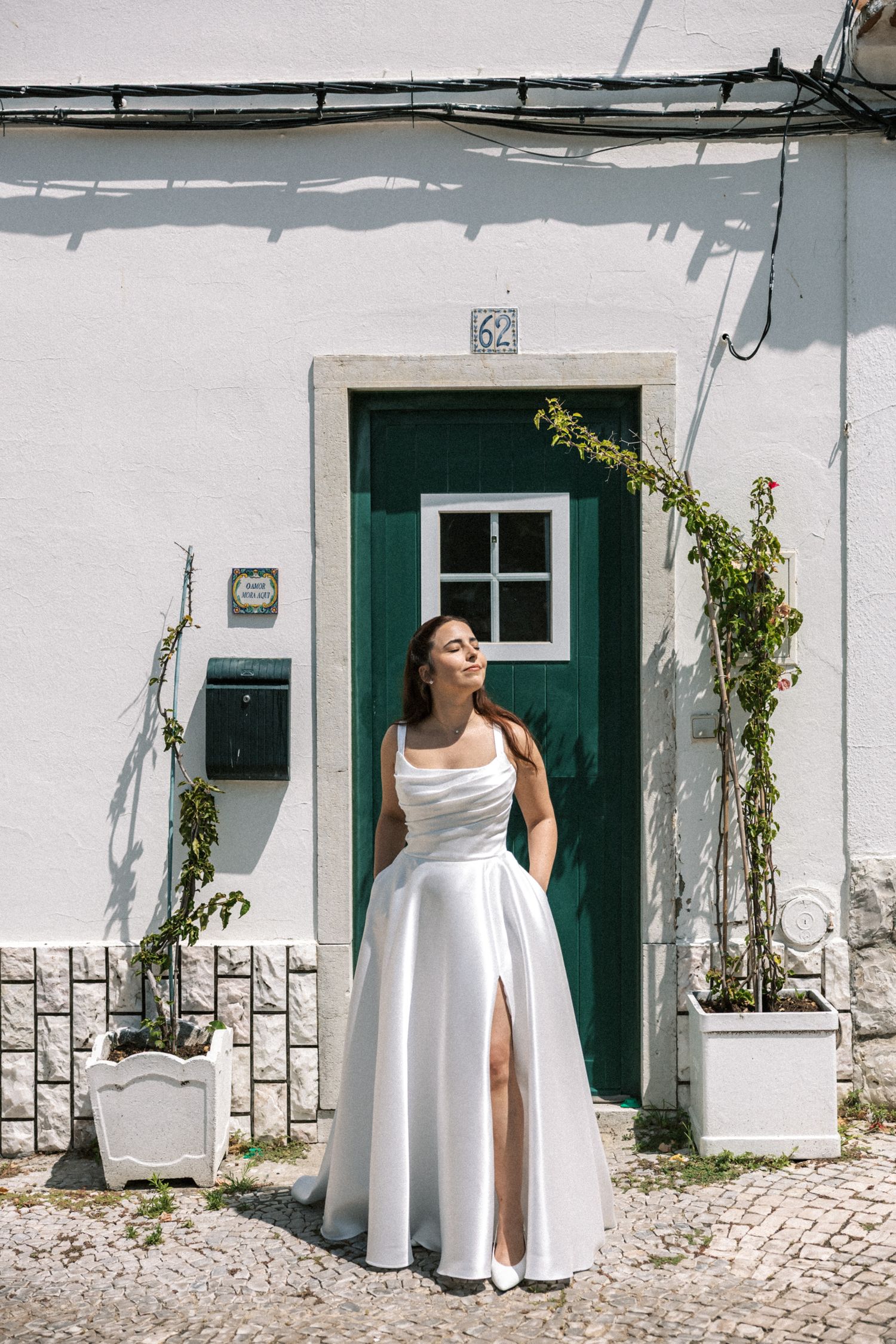 Bride portrait in front of traditional Portuguese house in Portugal