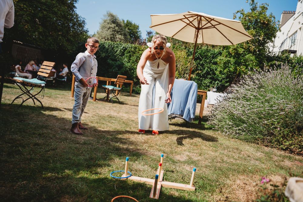 Garden party setup with umbrella and outdoor seating arrangements.