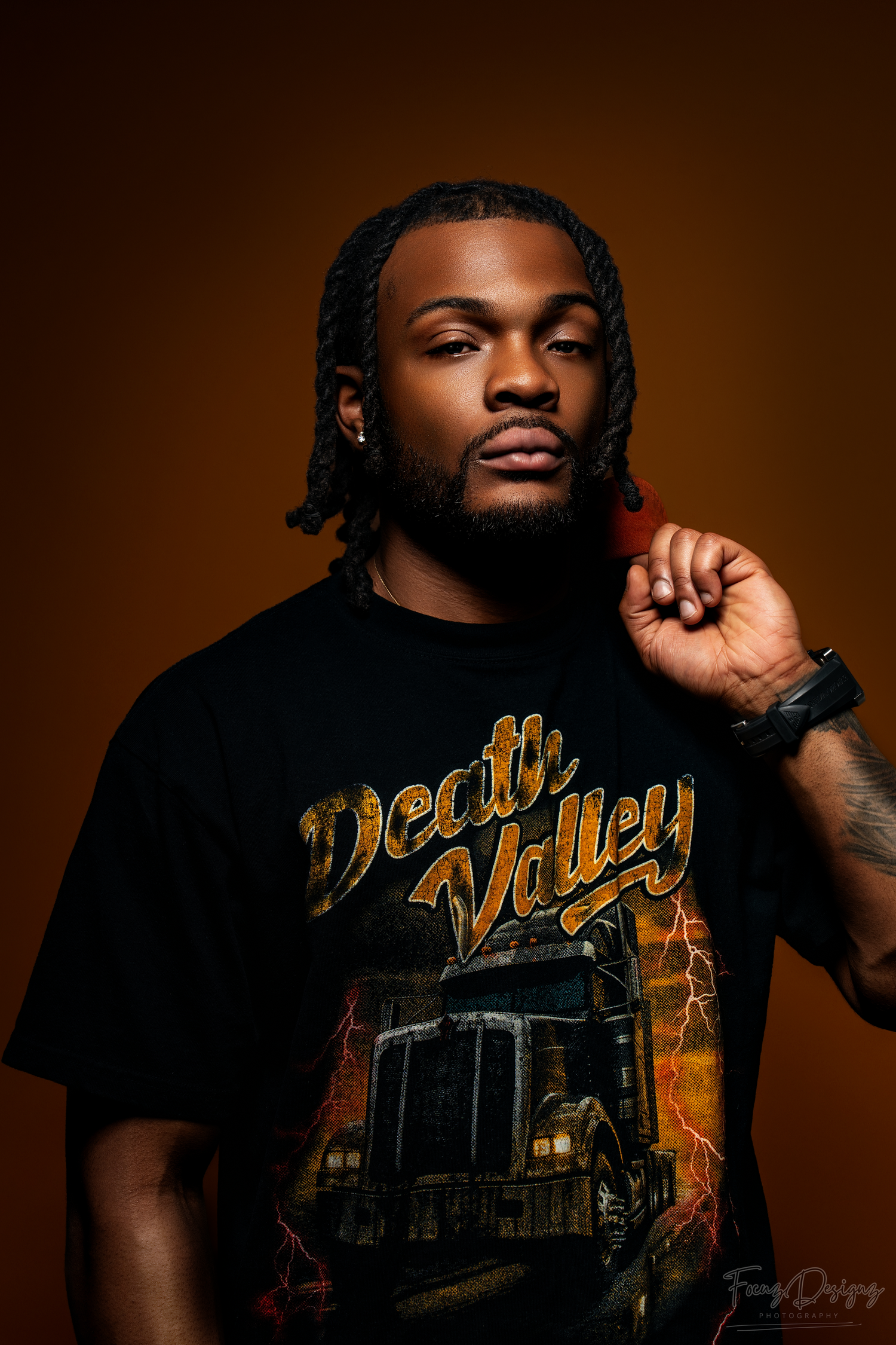 A dramatic portrait series showing a person in a black t-shirt with gold text against a dark brown background.