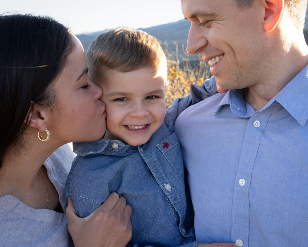 A series of candid family moments captured in six connected photos showing affectionate interactions outdoors.