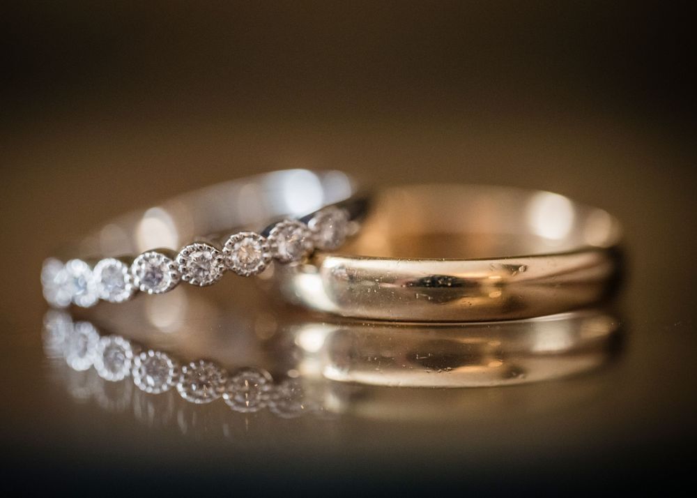 Close-up macro shots of elegant diamond wedding rings with sparkling details and bokeh effects.