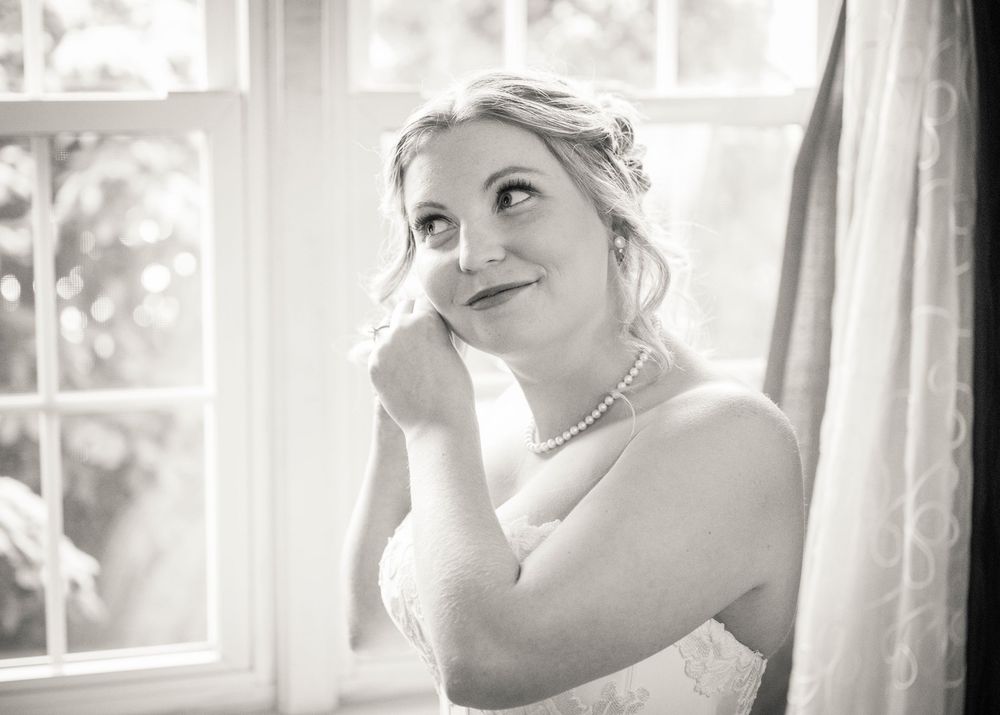 Series of romantic bridal preparation photos in soft window light with vintage tones.