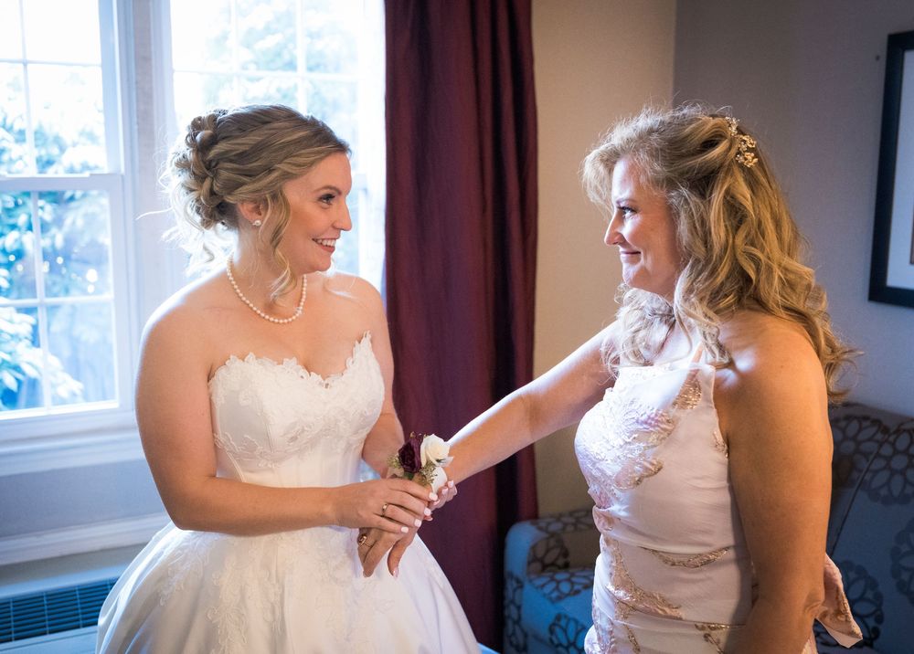 Multiple views of a bride getting into her wedding gown in a sunlit room with elegant decor.