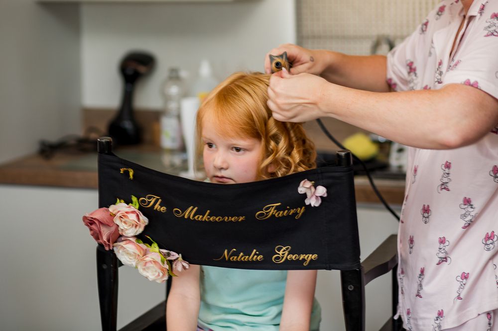 Wedding preparation details with director chairs and personalized name labels.