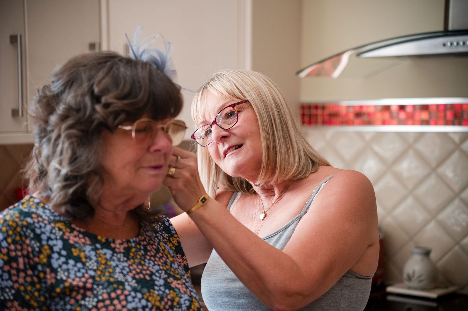 A touching series of candid moments between a grandmother and grandchild sharing laughter and affection at home.