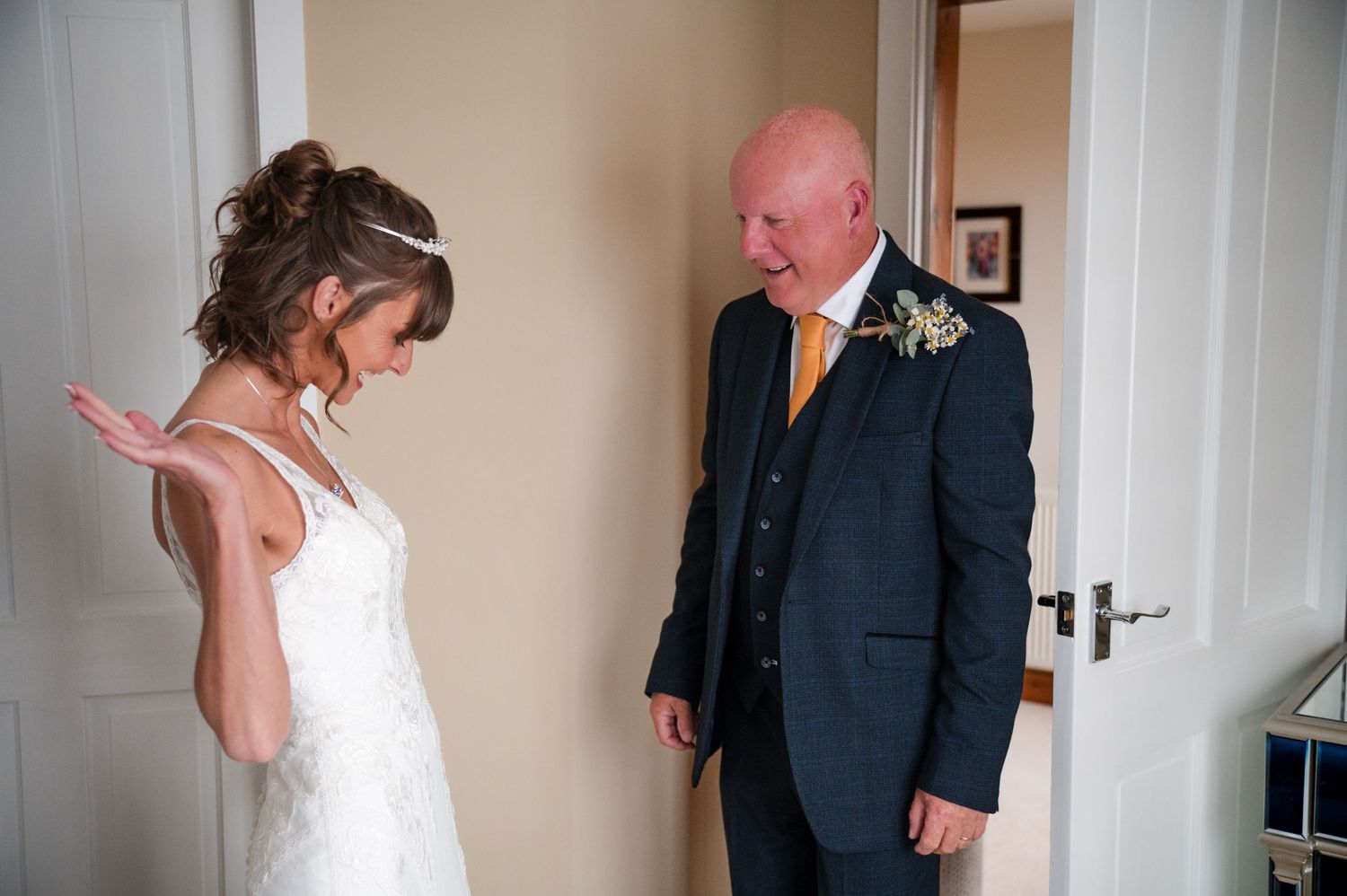 A sequence of four wedding photos showing a couple interacting and laughing together in a bright indoor setting.