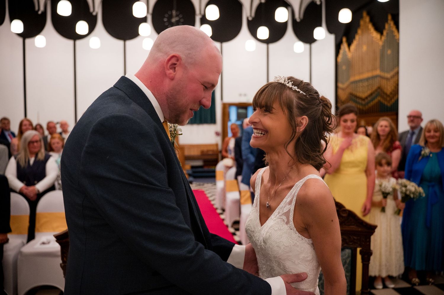 A series of candid moments from a wedding reception show couples dancing and celebrating on the dance floor.