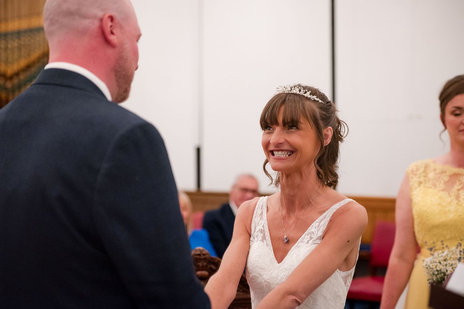 A wedding reception features candid moments between guests and the newlyweds in a series of connected photos.