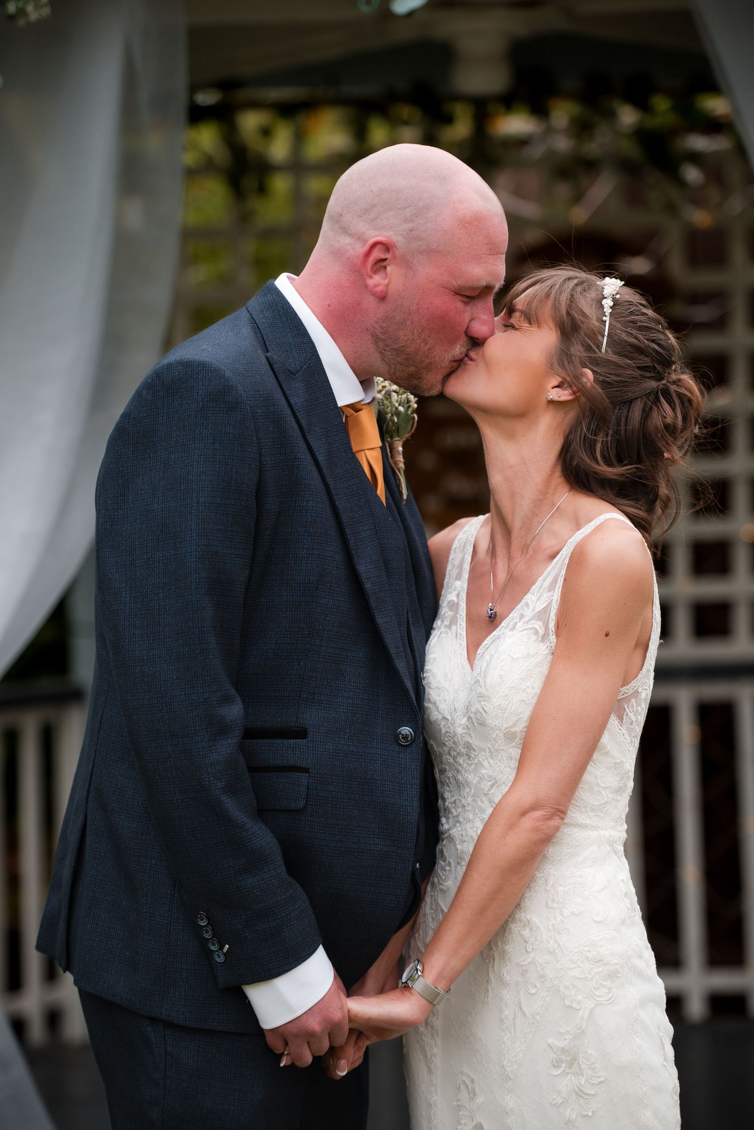 A romantic sequence of wedding photos showing a couple sharing a tender kiss in formal attire.