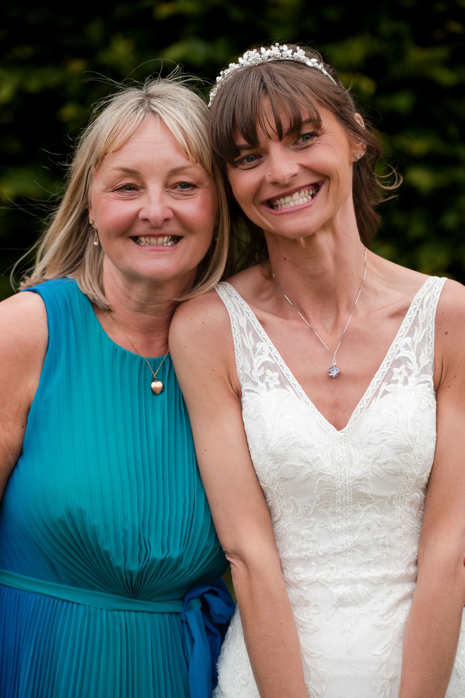 Two people in wedding attire and turquoise dress share joyful moments in a series of candid outdoor photos.