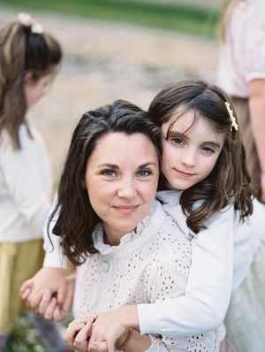 Close portrait of two people sharing a sweet moment outdoors.