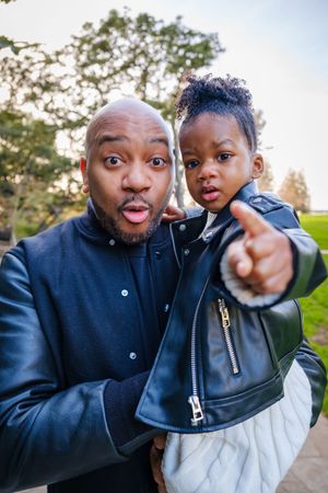 Two people in dark jackets pose playfully together in a series of outdoor selfie-style photos.