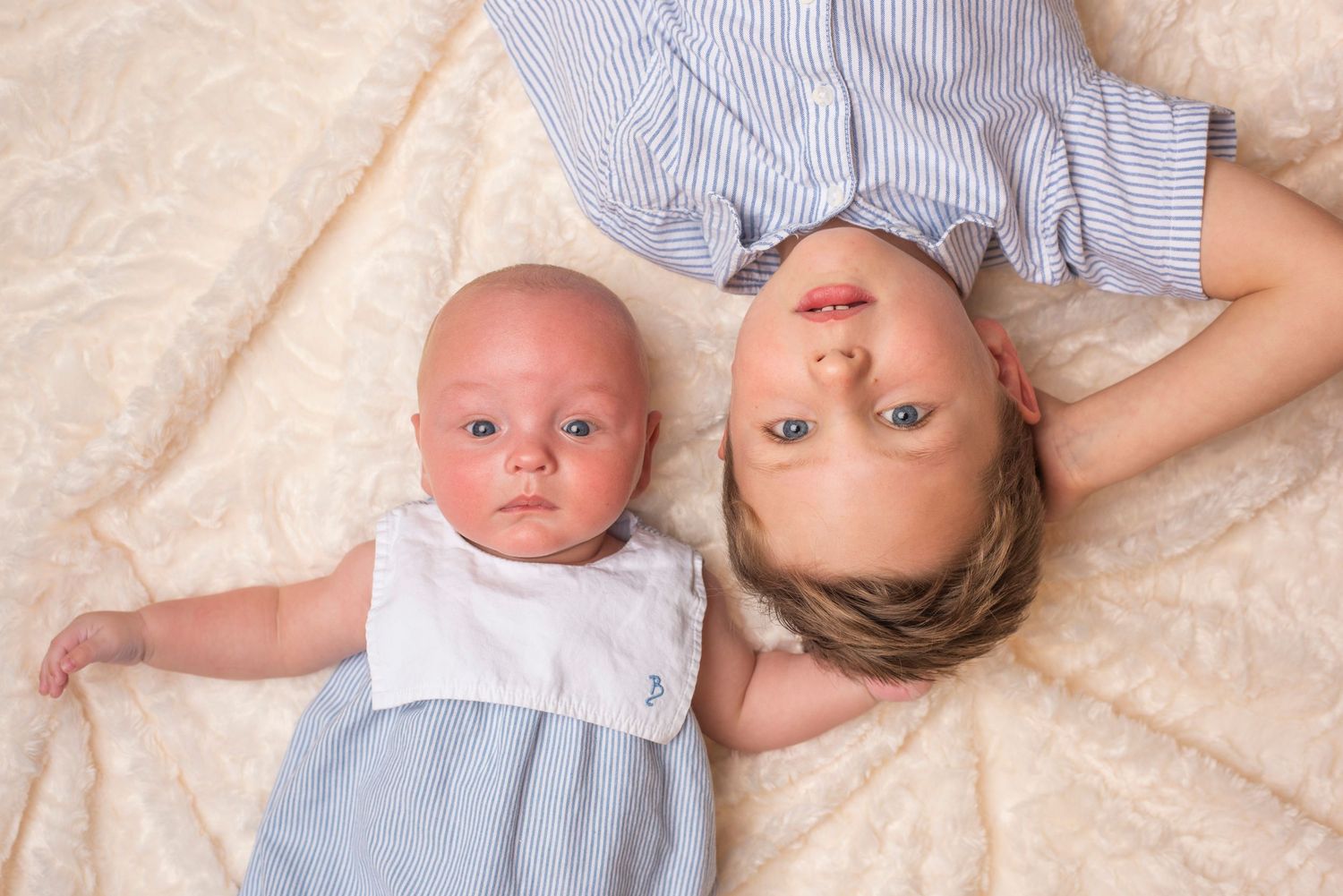 Sibling pose in the studio.