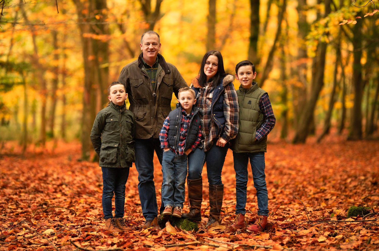 Autumn colours, family woodland portrait in Berkshire woodland.