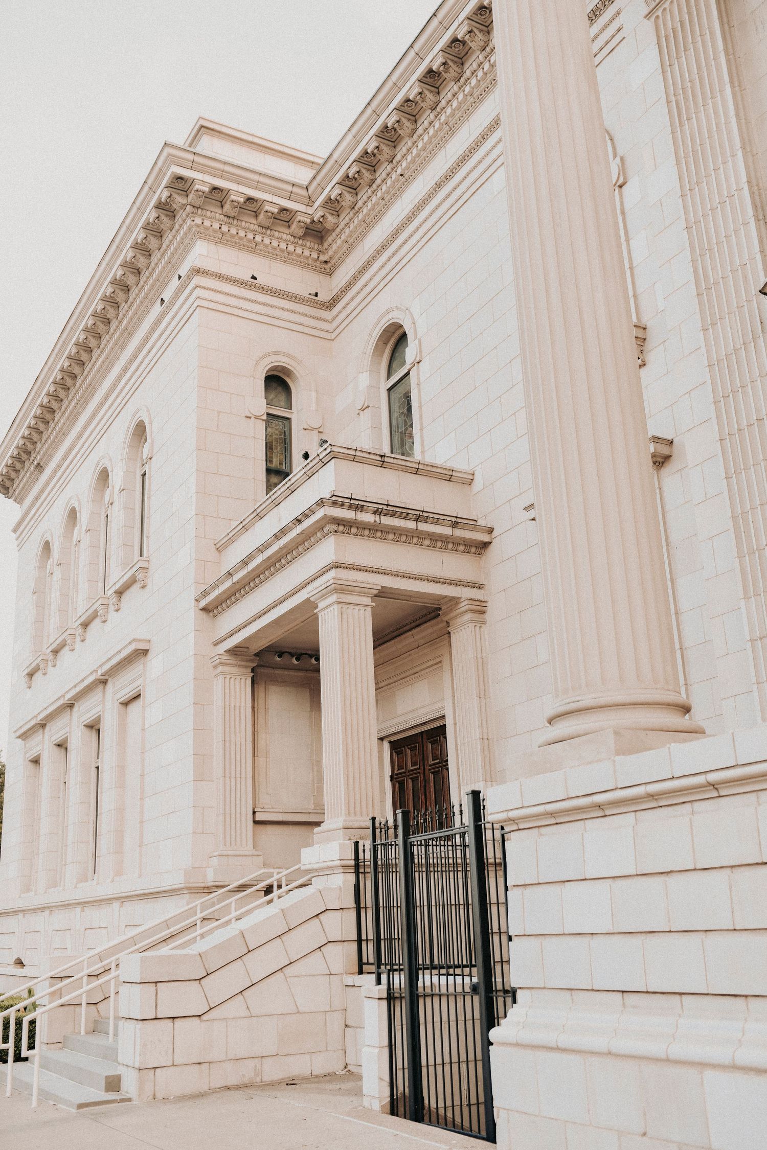 Elegant engagement portrait featuring Dallas historic architecture