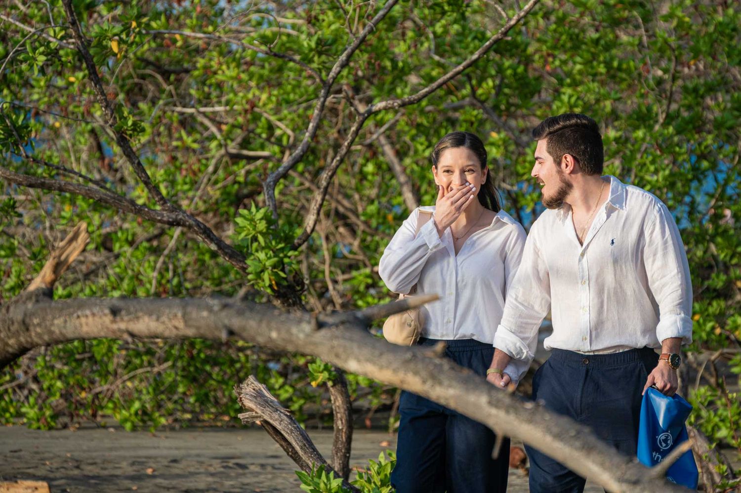 Couple celebrating proposal during sunset in Playas del Coco Costa Rica
