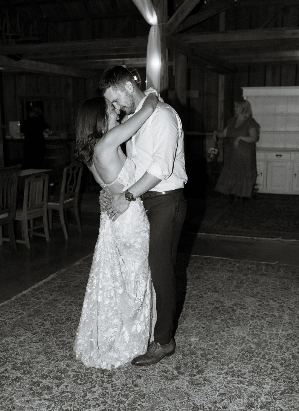 Black and white photos of couples dancing at a barn wedding reception.