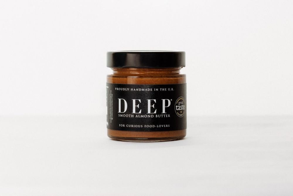 Multiple jars of Deep brand product displayed on white surface.