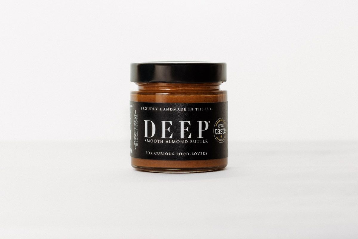 Multiple jars of Deep brand product displayed on white surface.
