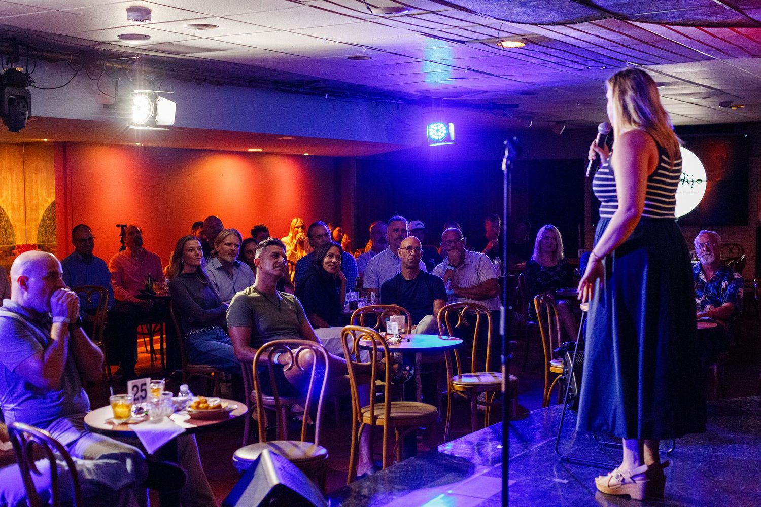 Comedian on stage at a comedy show. San Juan, Puerto Rico.