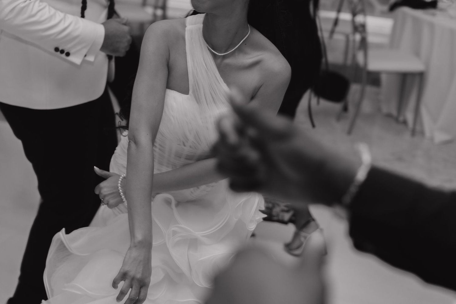 Artistic black and white wedding dance detail at Majestic Elegance Costa Mujeres, elegant destination wedding photography.