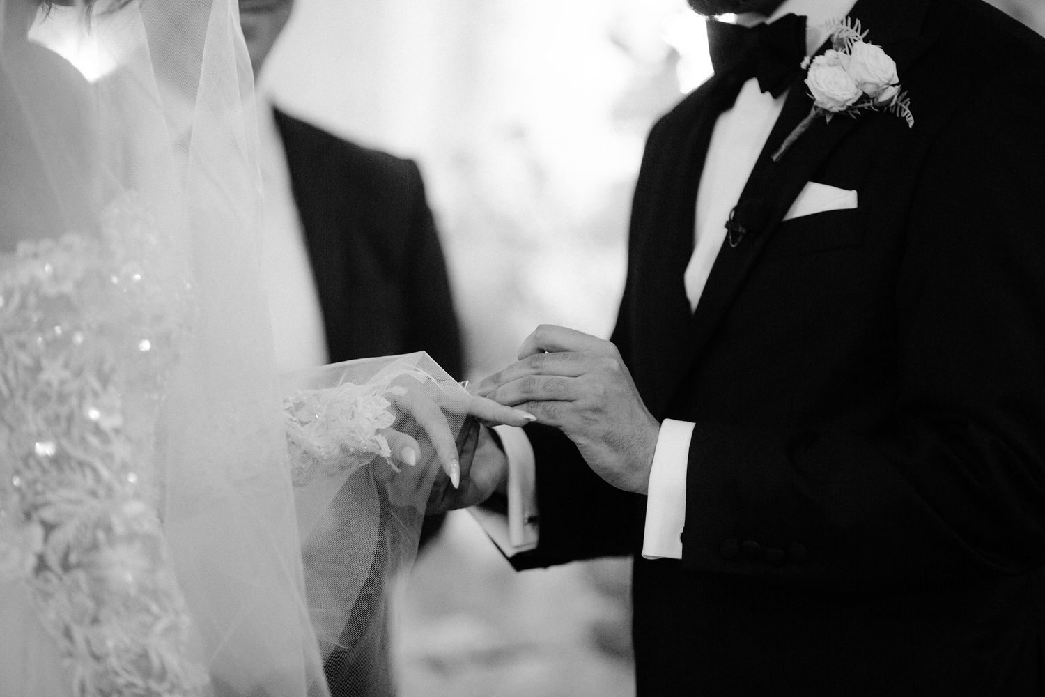 A black and white collage of wedding photos showing couples in formal attire embracing and celebrating their special day.