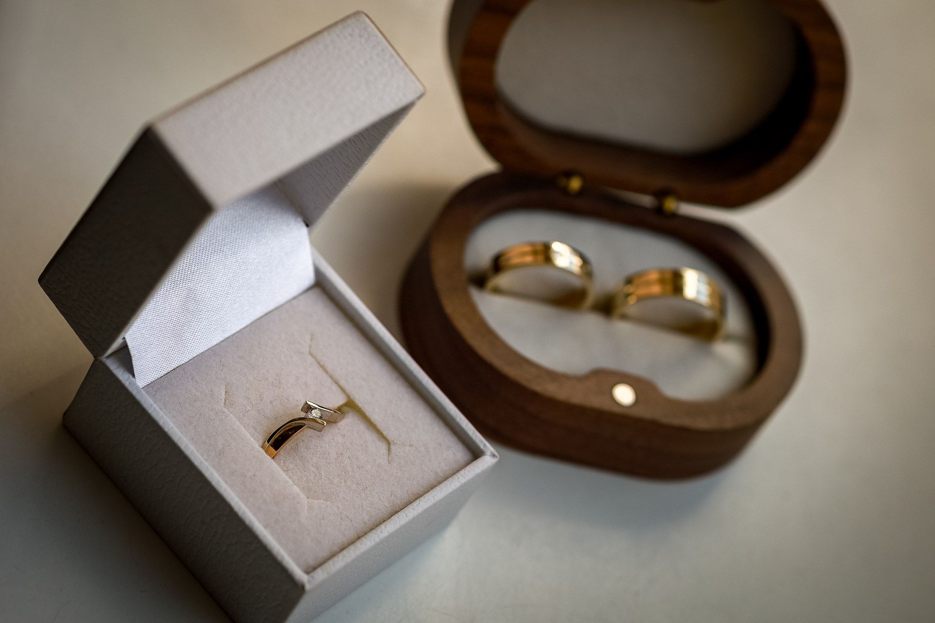 Wedding ring boxes and jewelry displays arranged in a series of detail shots.
