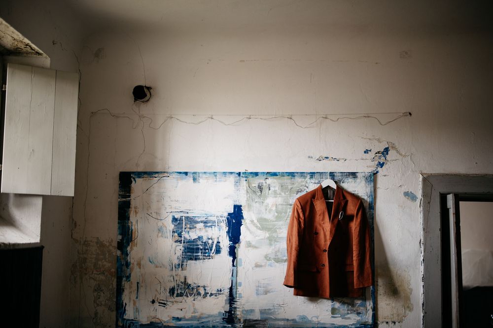 Minimalist industrial interior space with white walls and exposed architectural details.