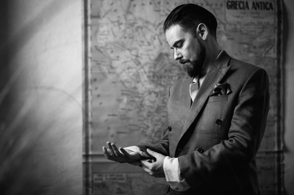 A series of vintage black and white photographs showing a person in formal attire examining objects.