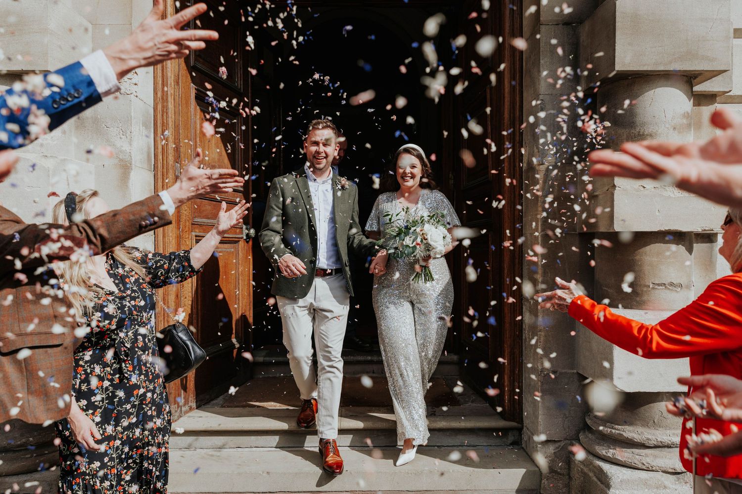 Short Wedding Photography in Bath. Confetti outside of Guildhall . Happy Bride and Groom