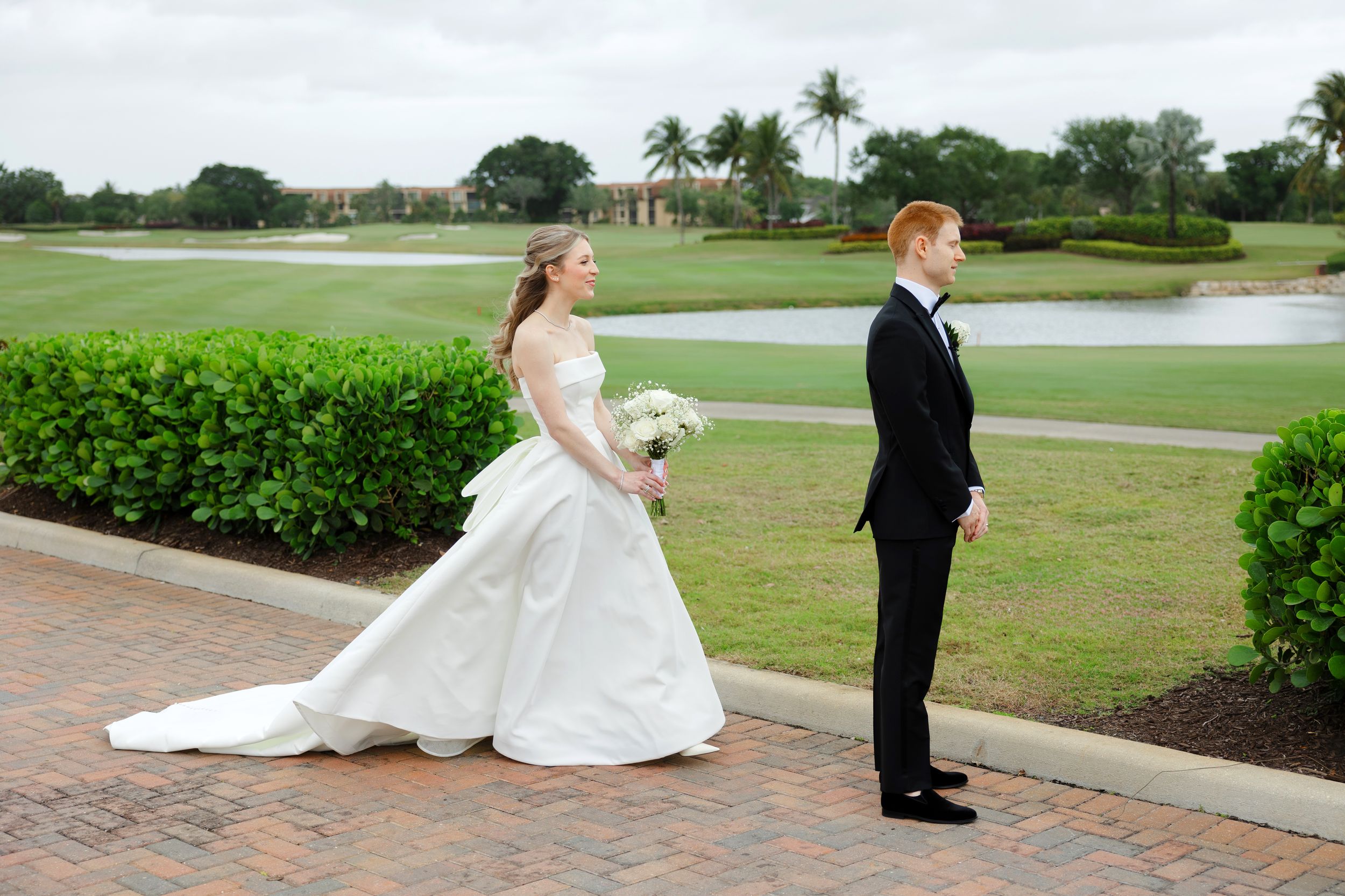 Bride and groom first look at BallenIsles Country Club in Palm Beach during a wedding photographed by Ohio photographer Tom Forrest.