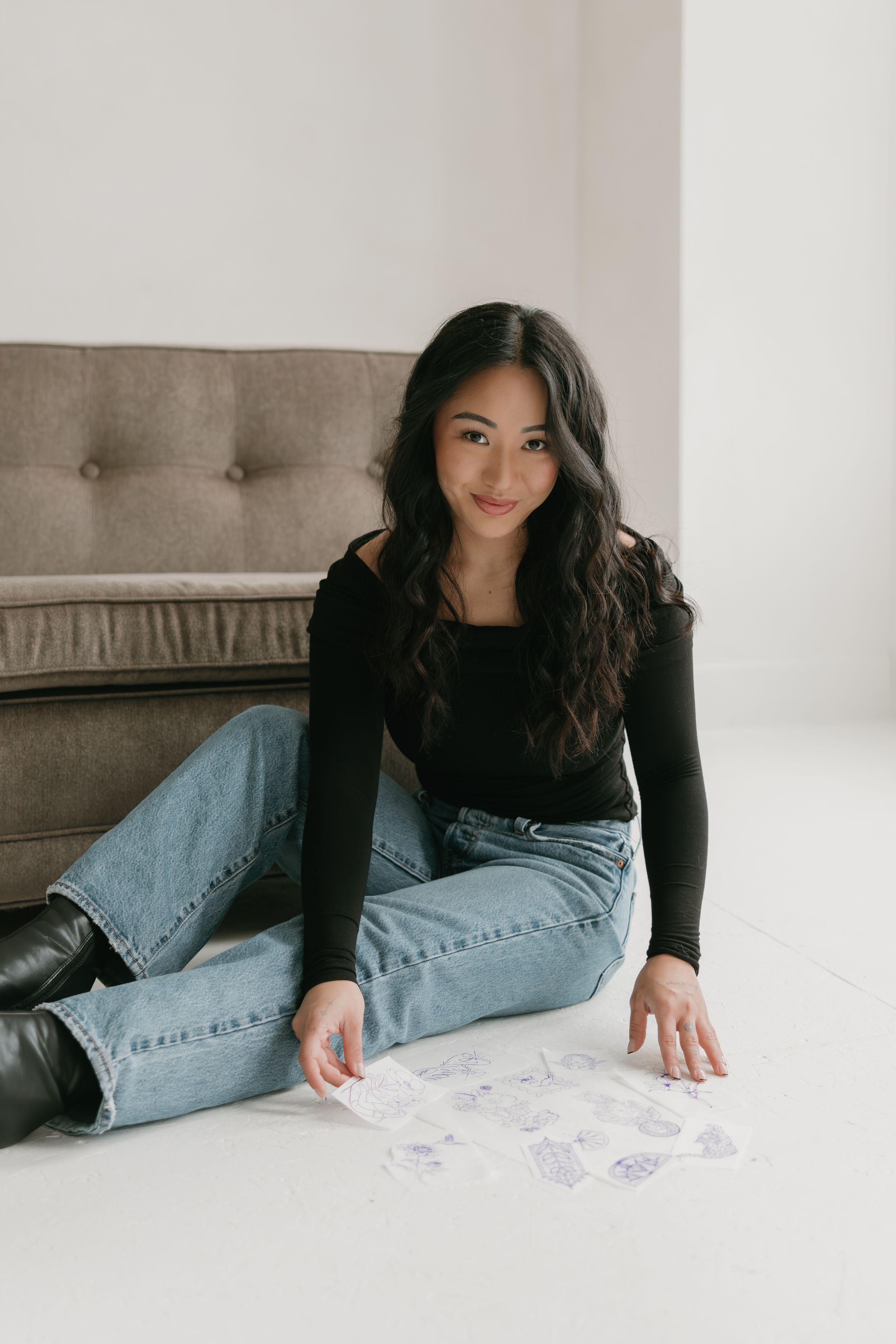 A series of artistic portraits showing someone lounging on a gray couch in light-washed minimalist setting.