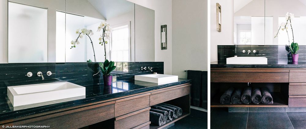 Modern black kitchen countertop with sleek stainless steel fixtures and minimalist design details.