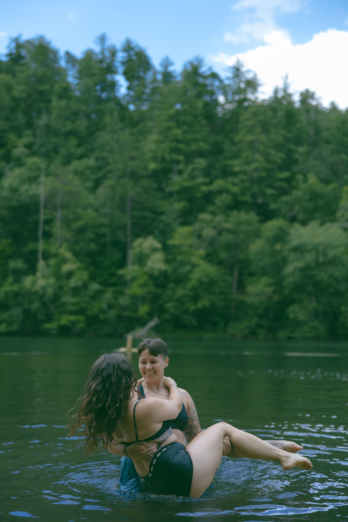 lgbtq adventure elopement queer couple alternative wedding asheville NC SC TN GA lake swimming romantic moody photographer