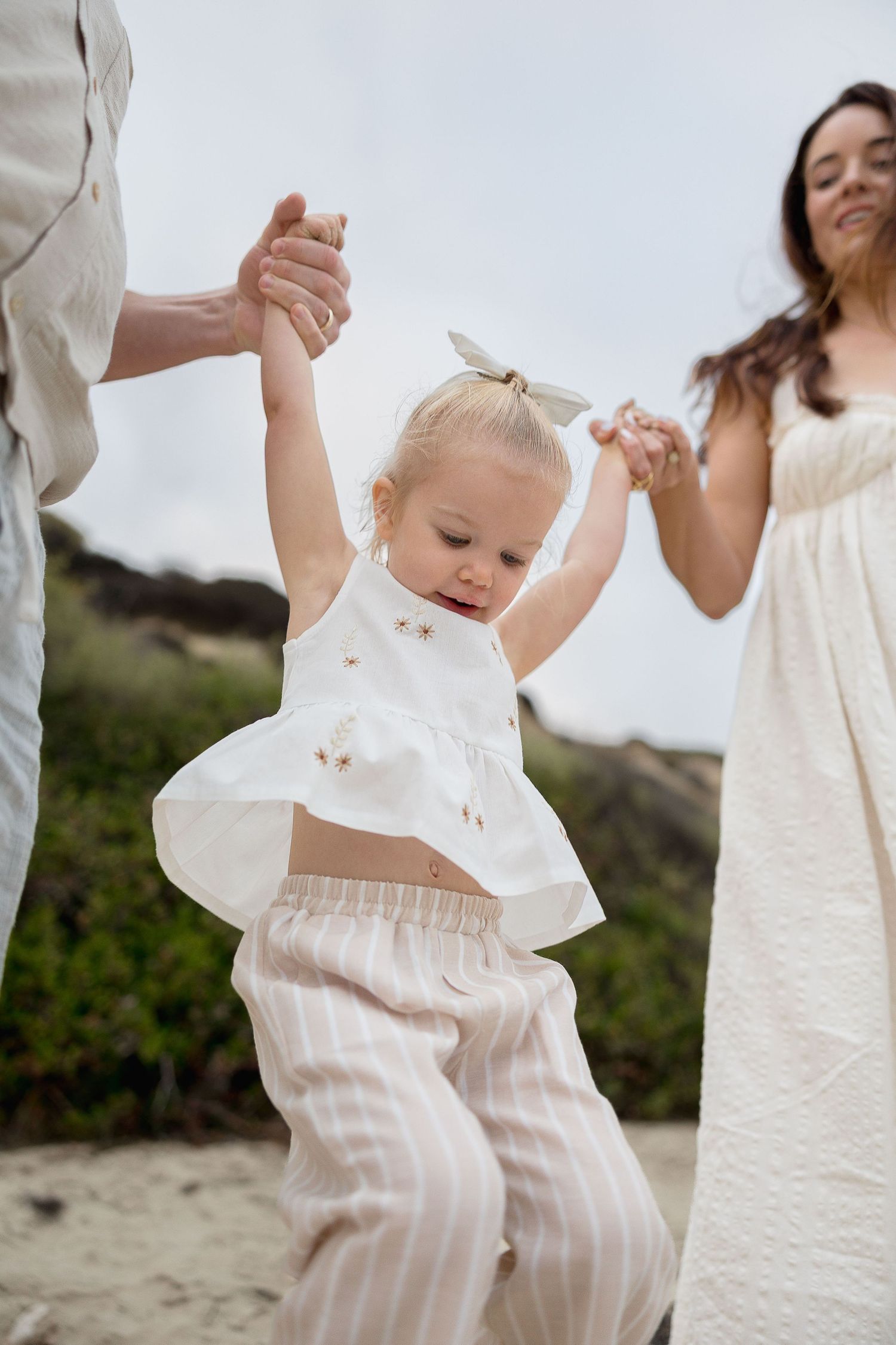 Family beach photos at Crystal Cove with real emotions and candid play