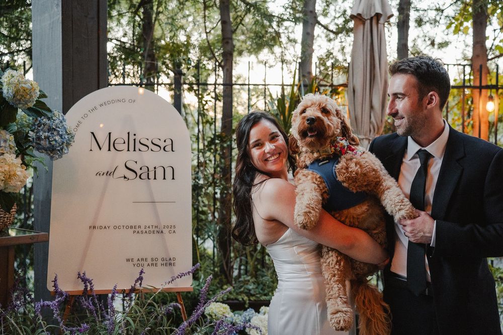 Bride and groom posing with their dog Rory at their Pasadena wedding
