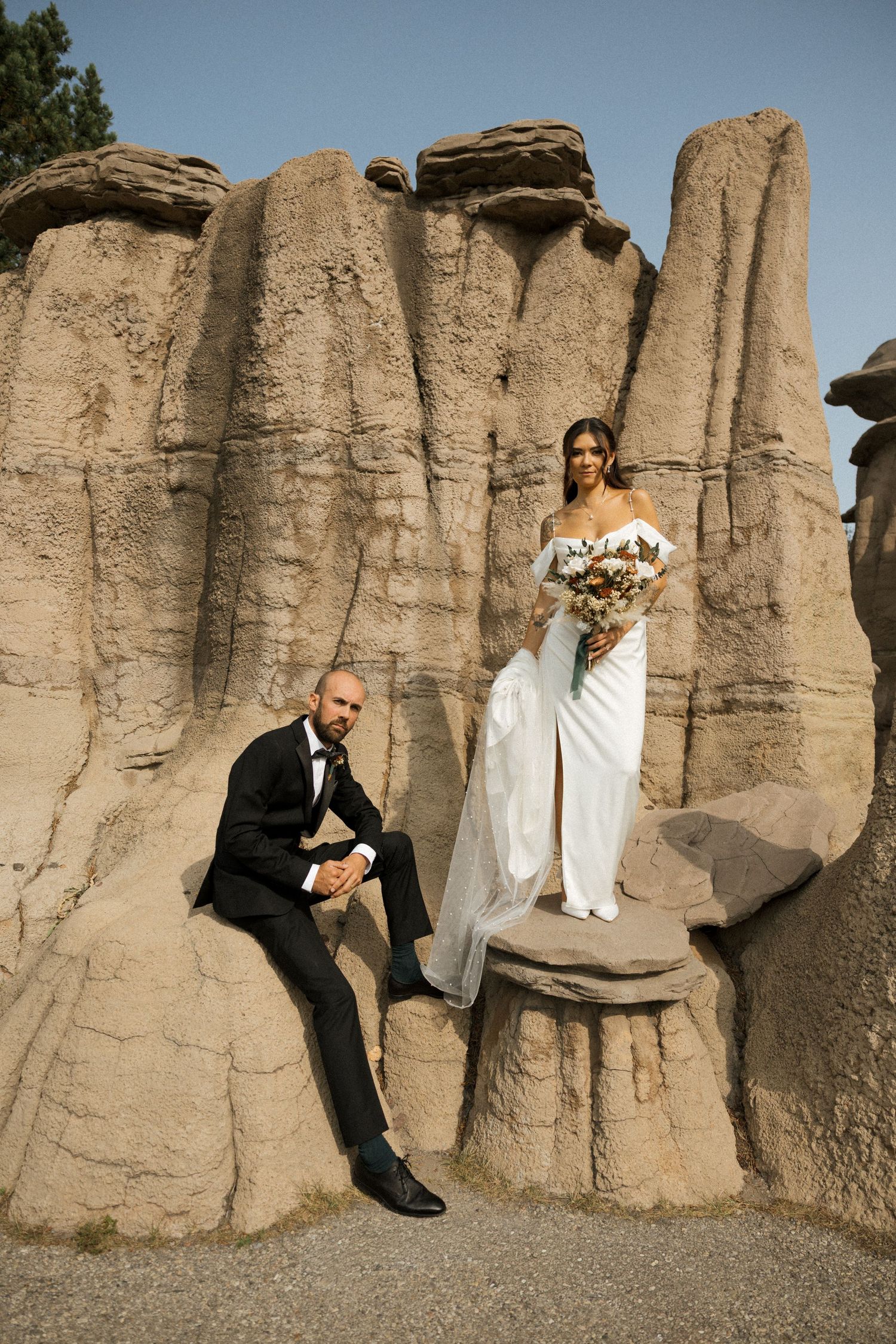 Wedding party members jump and pose playfully for a series of fun outdoor photos at sunset.