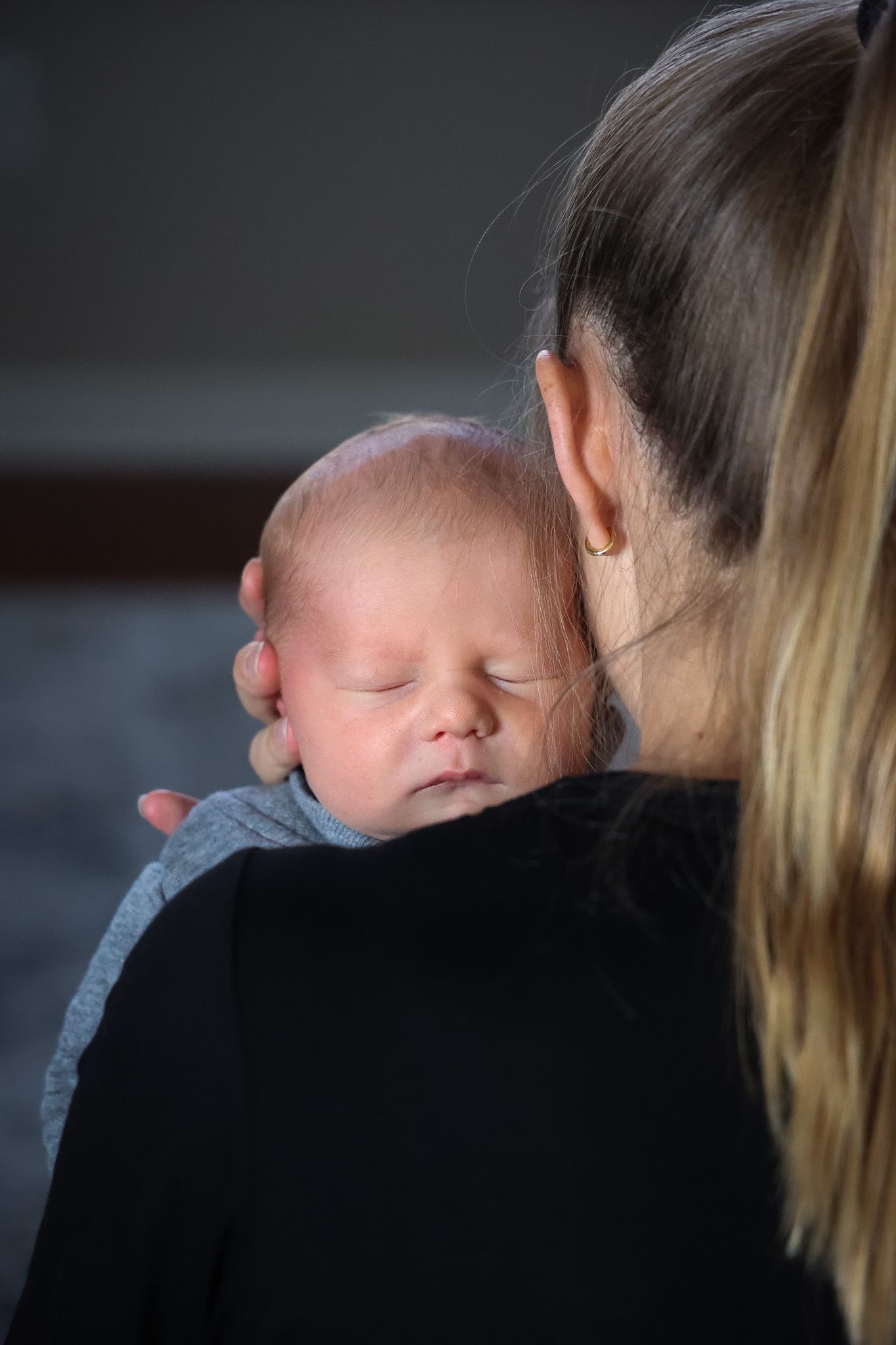 Close-up profile shots showing tender parent-child bonding moments.