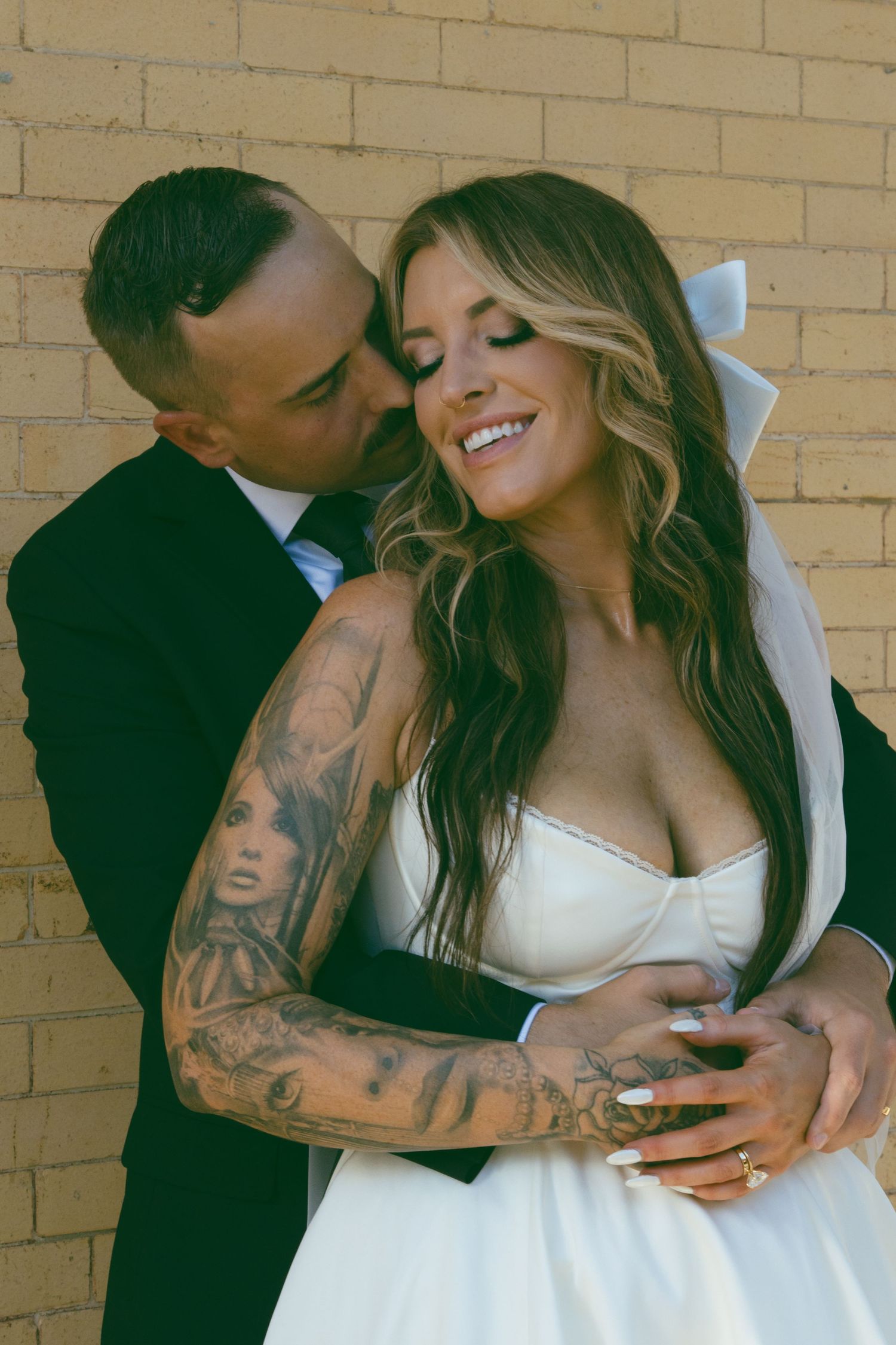 downtown elopement NC SC GA TN tattooed bride model couple snuggling wedding dress courthouse wedding