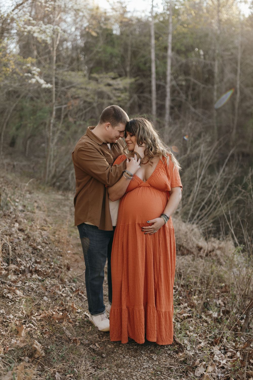 Romantic sunset moment captured on woodland trail. Virginia/ North Carolina Maternity Session