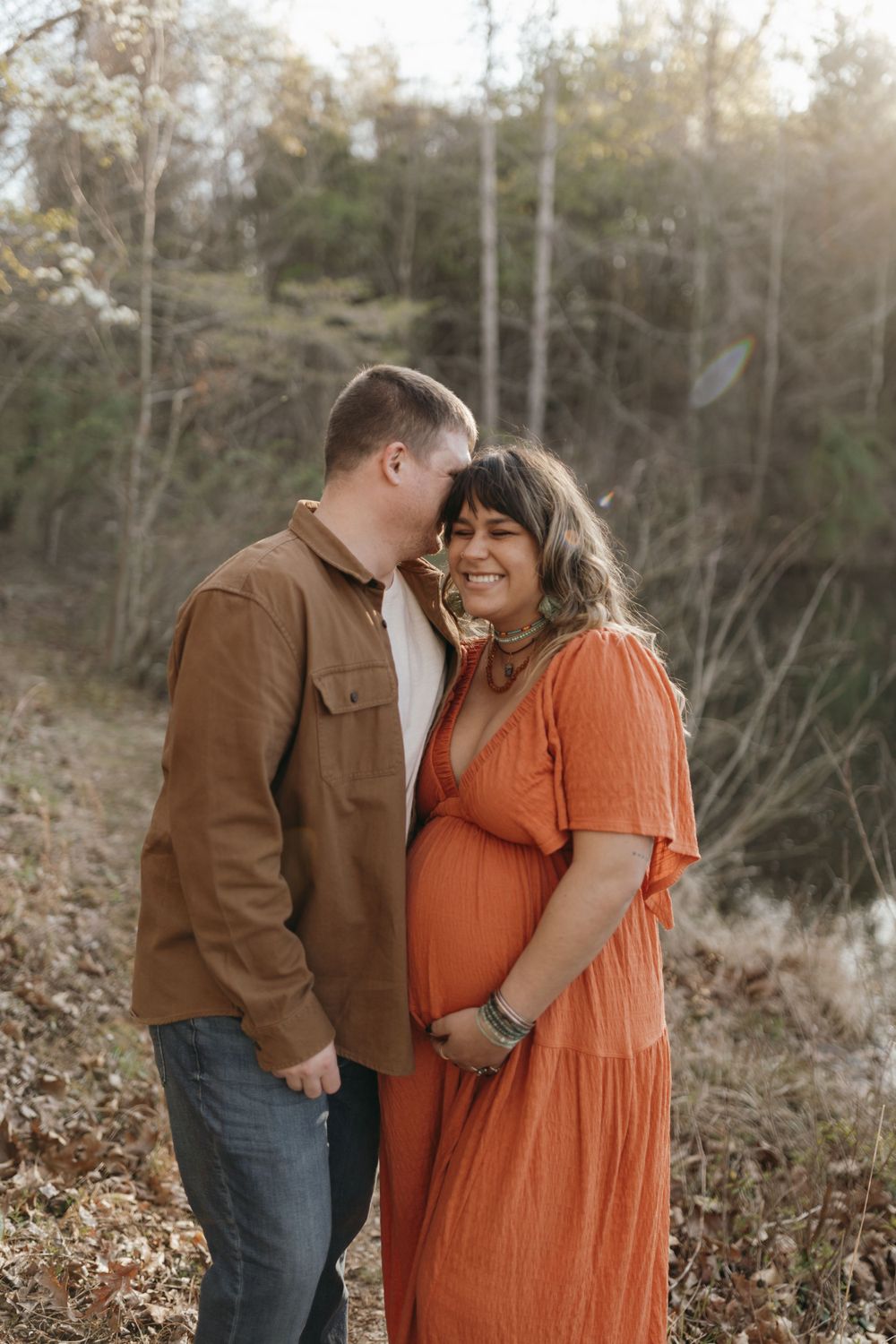 Intimate outdoor portrait against wooded backdrop at sunset. Virginia/ North Carolina Maternity Session