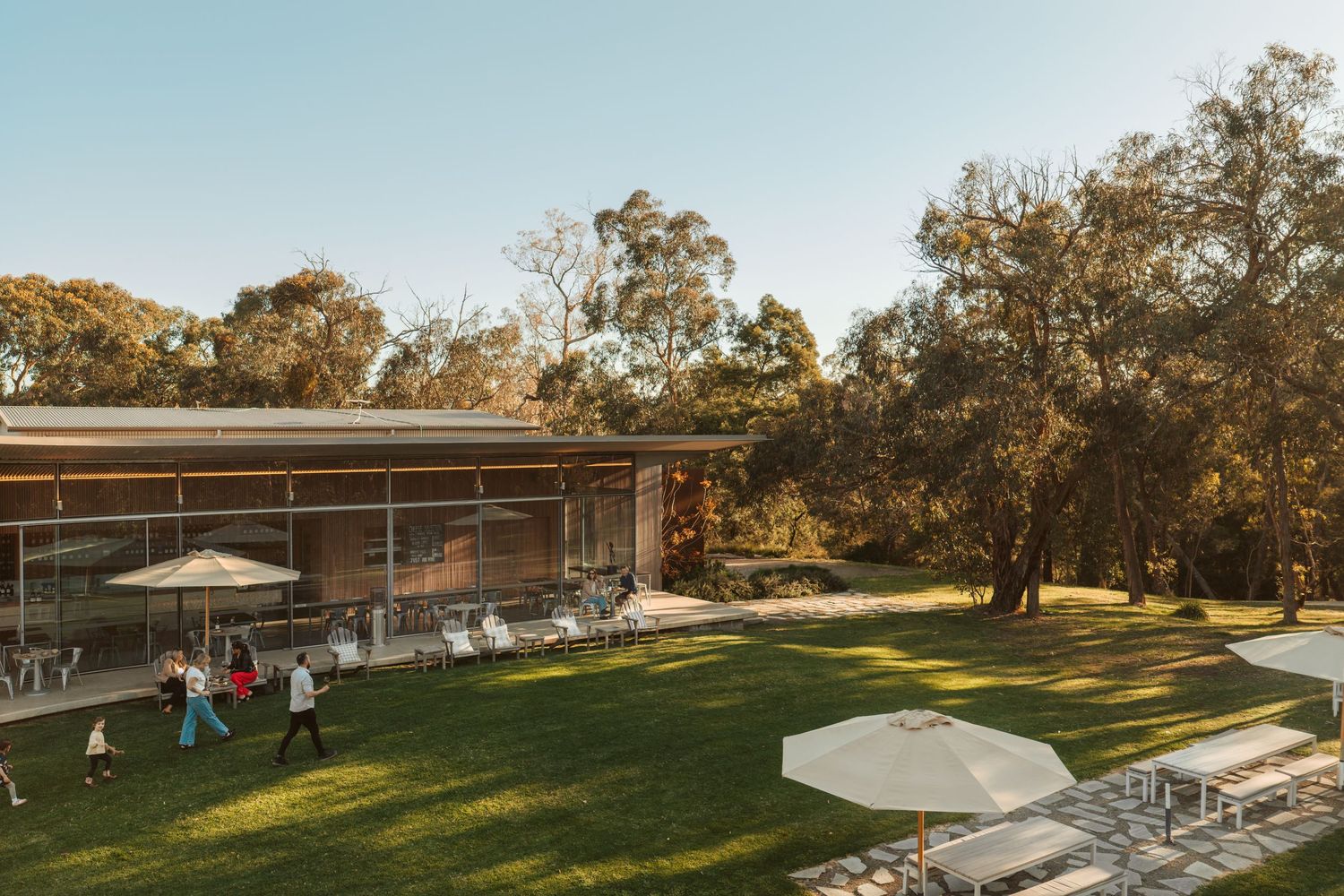 Hospitality and accommodation photography capturing landscaped grounds and modern venue architecture in natural light