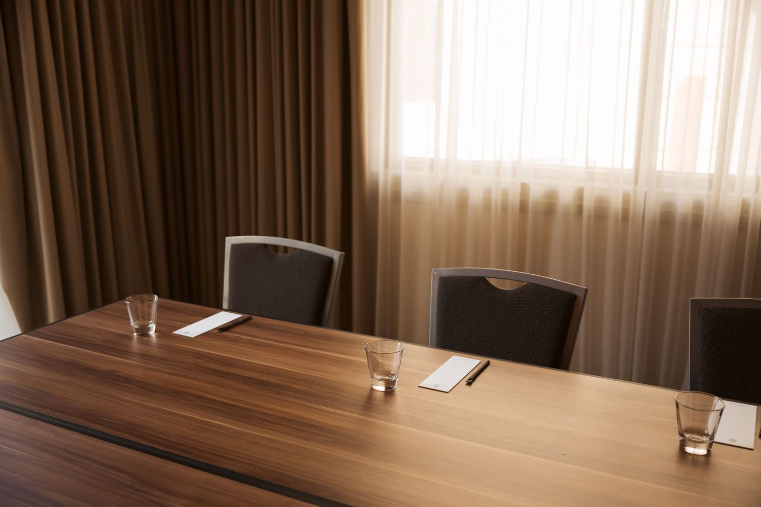Commercial meeting room photography featuring warm timber finishes and modern interior styling in natural light