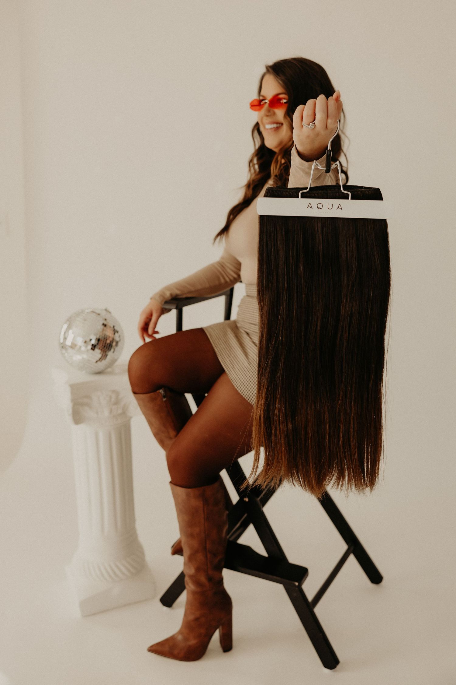 Professional branding photoshoot of a woman entrepreneur in a modern office setting.