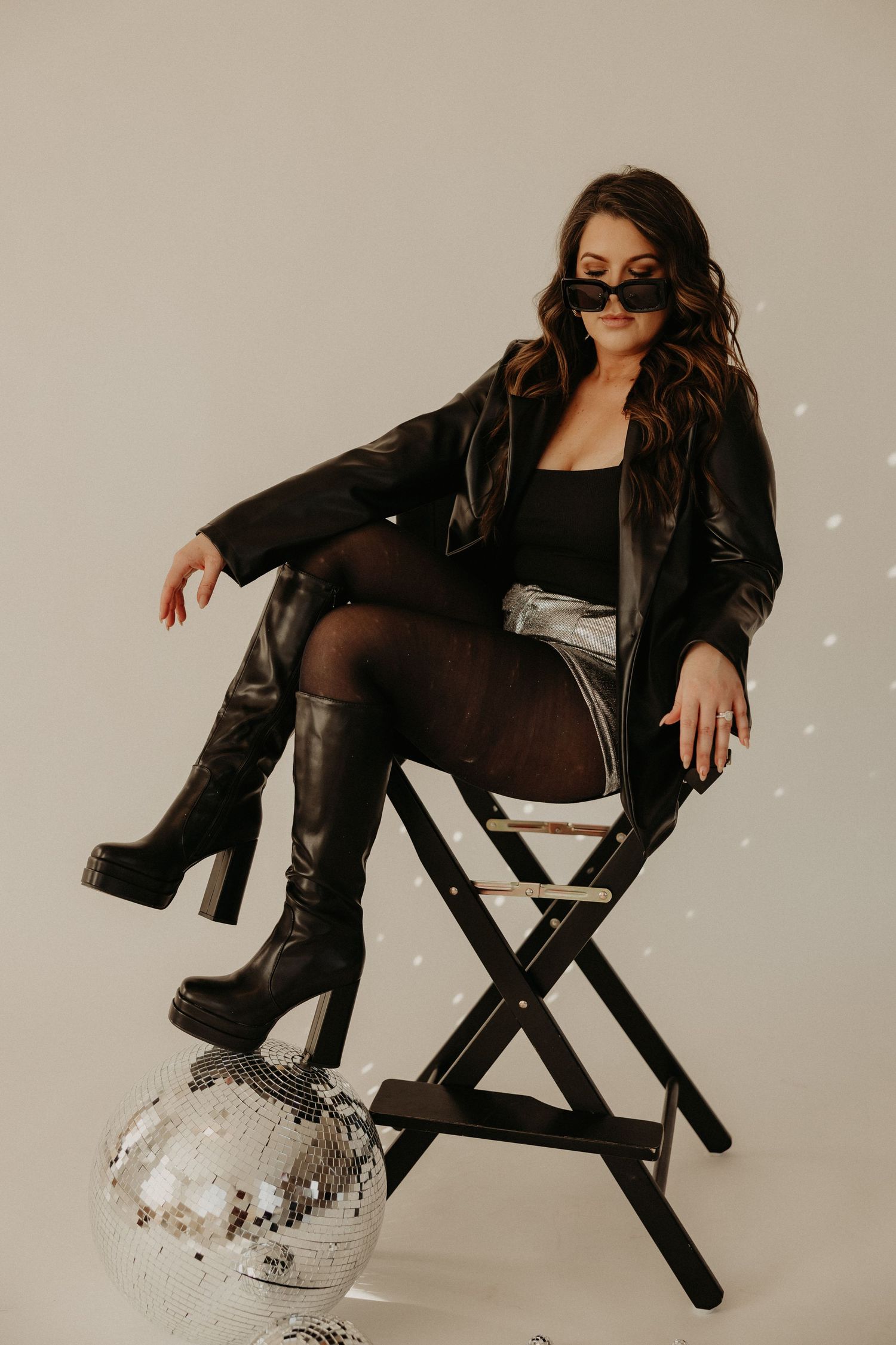 Professional branding photoshoot of a woman entrepreneur in a modern office setting.