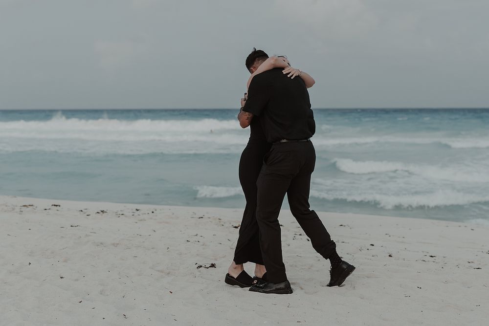 Romantic embrace after saying yes during a Riviera Maya engagement session.