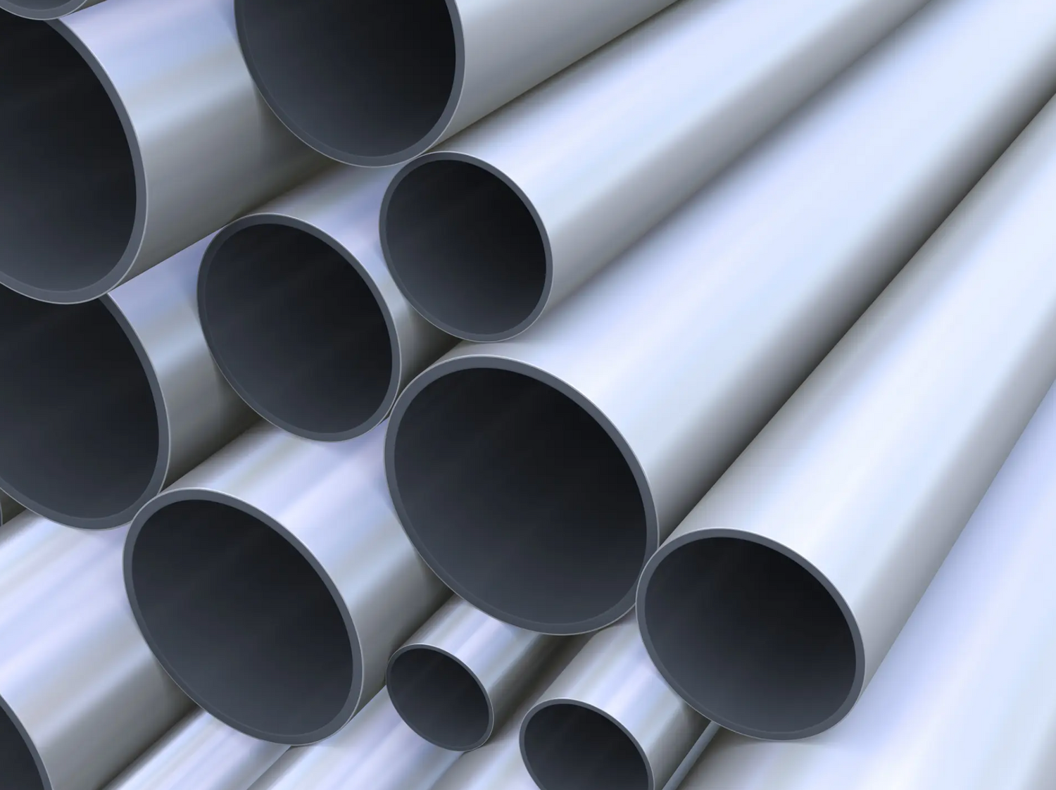 Collection of smooth silver industrial pipes arranged in parallel formation.