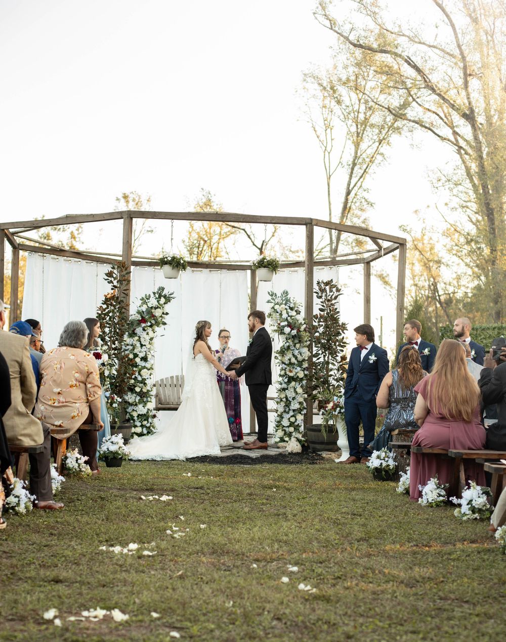 Beautiful backyard wedding ceremony in Live Oak, Florida. Photographed by AJ Herron Photography
