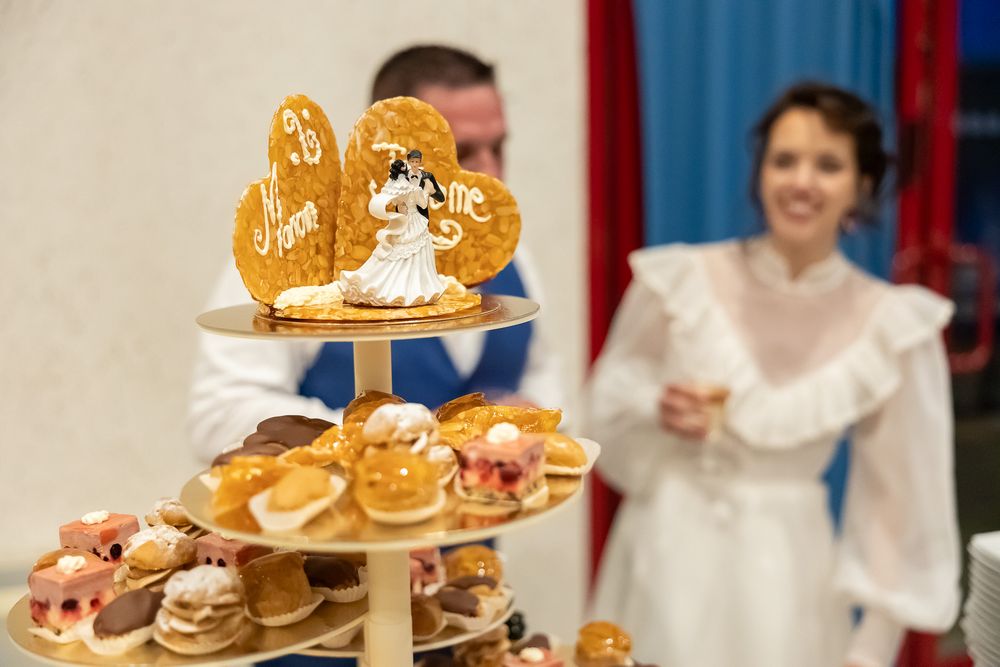 Elegant tiered display of pastries and treats at a wedding reception.